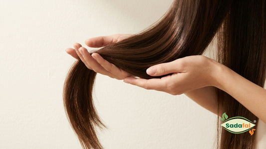 Sadafal Almond Oil for Hair applied by a woman for hair growth, strength and shine